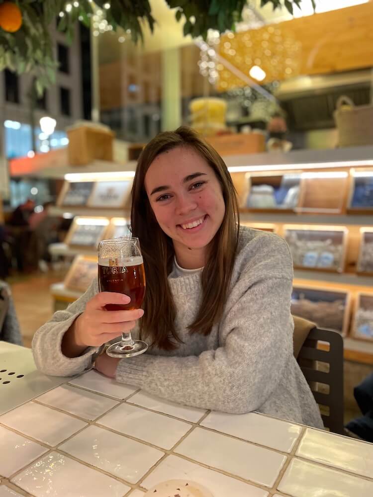 Girl drinking Valencian beer Turia